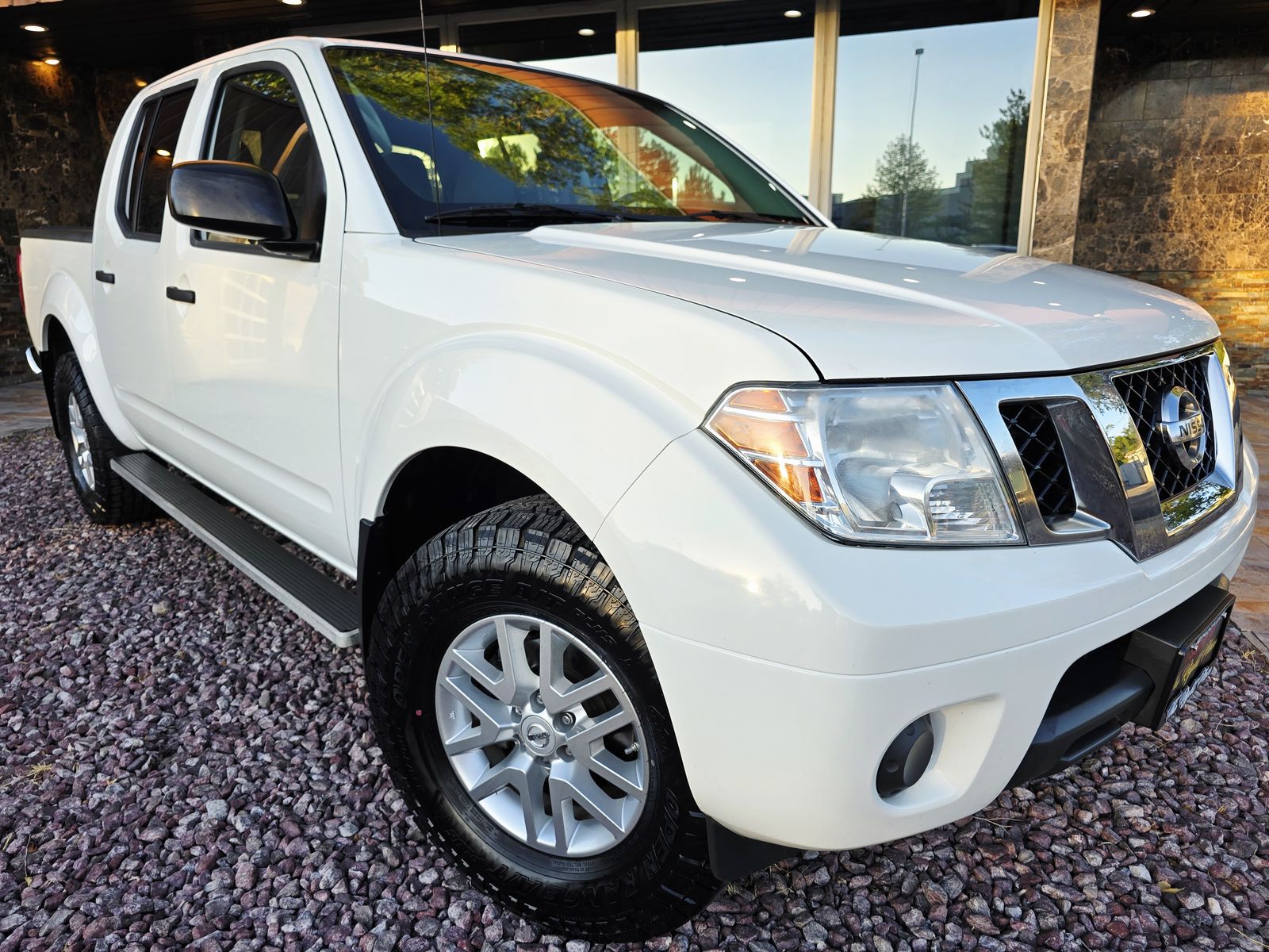2019 Nissan Frontier SV — rebuilt & branded title, 18% below market