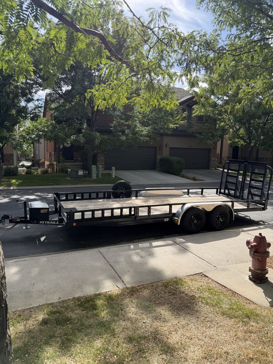 20ft PJ Tandem-axle utility trailer with 83" wide wood deck