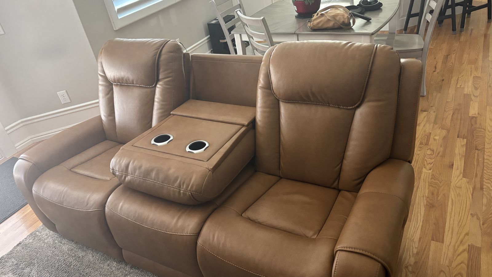 3 person Tan Leather Reclining Sofa with optional Console regular price 4 k (like new)