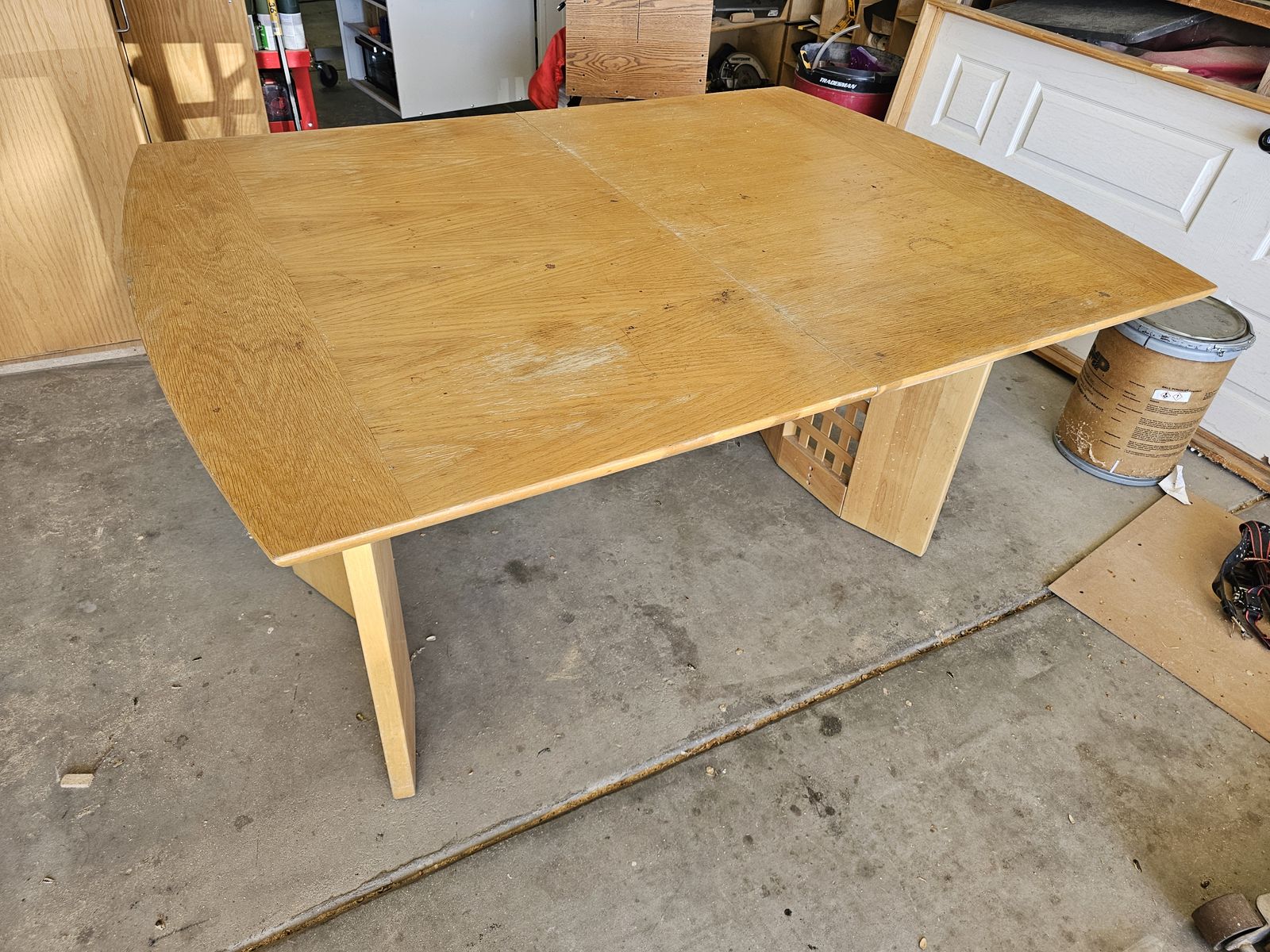 Old wooden table. Missing bolts and one horizontal support.