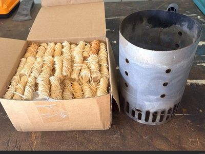 Charcoal chimney starter with box of fire starters