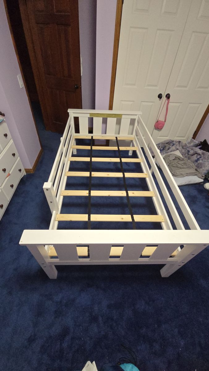 Twin mattress bed frame with fall protection wall