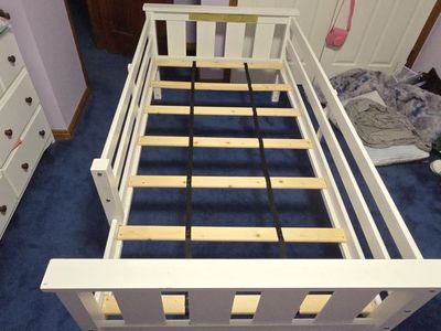 Twin mattress bed frame with fall protection wall
