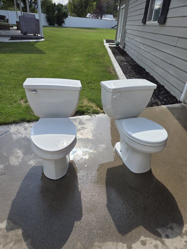 Pair of White Ceramic Two-Piece Toilets