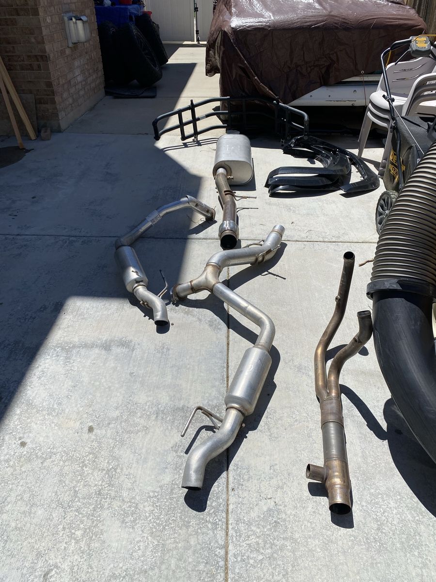 OEM cat back exhaust Chev Silverado 6.2 L. Less than 1k on system.