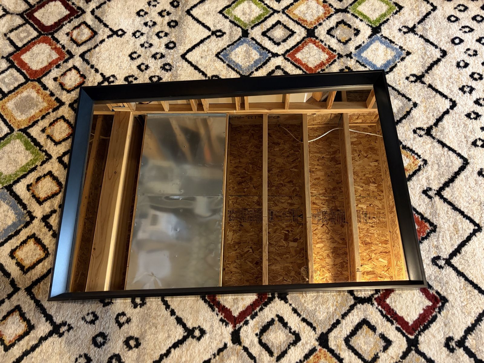 black, modern, rectangular wall mirror