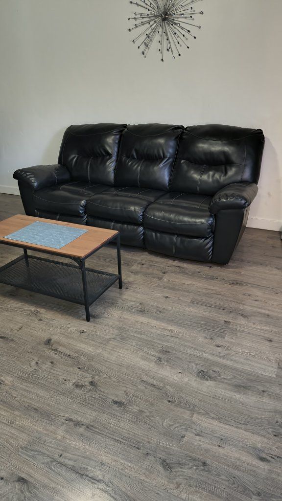 Black Faux Leather 3-Cushion Reclining Sofa