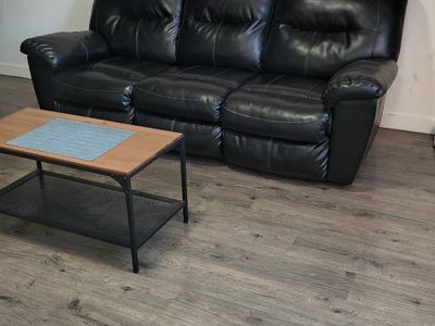 Black Faux Leather 3-Cushion Reclining Sofa