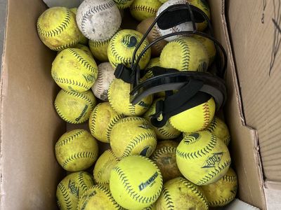 Box over 30 softballs pitching mask
