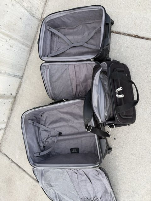 Tumi Brief Case, and Two Carry-On Travel Suitcases
