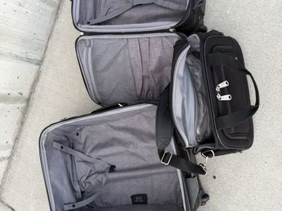 Tumi Brief Case, and Two Carry-On Travel Suitcases