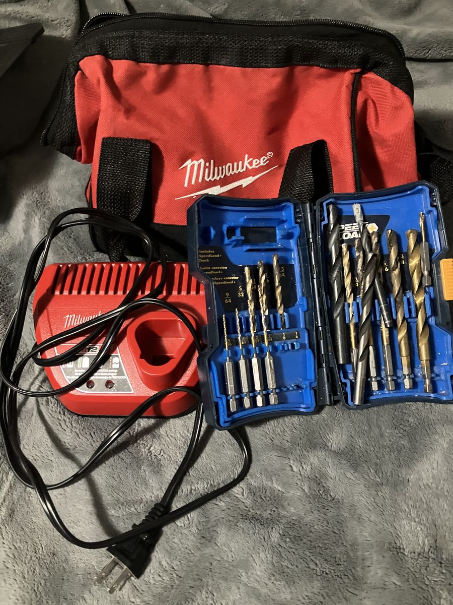 Milwaukee 3/8ths drill driver, 1/4 hex impact driver, and Ryobi drill bits.