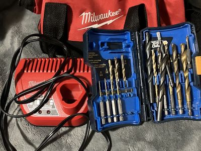 Milwaukee 3/8ths drill driver, 1/4 hex impact driver, and Ryobi drill bits.