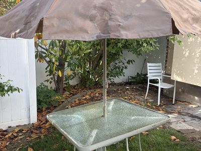 Patio table, umbrella, chairs