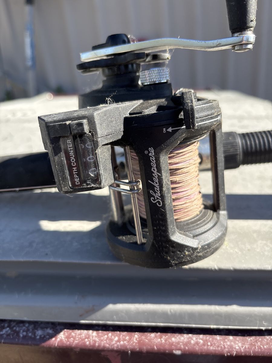Shakespeare Fishing Reel with Depth Counter and 9 foot trolling pole Shakespeare ugly stick - Used barely .