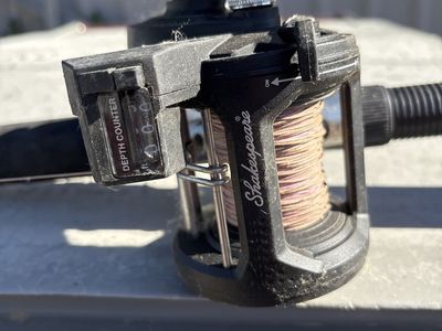Shakespeare Fishing Reel with Depth Counter and 9 foot trolling pole Shakespeare ugly stick - Used barely .