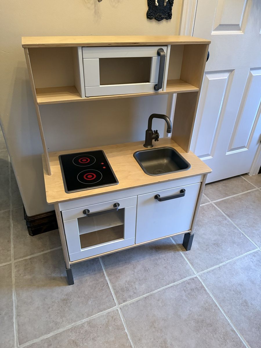 Kids play kitchen legs can extend or shorten