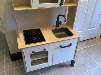 Kids play kitchen legs can extend or shorten