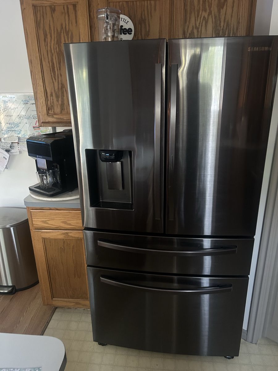 Samsung Black Stainless Kitchen Appliance Package - Refrigerator, Electric Range, Microwave