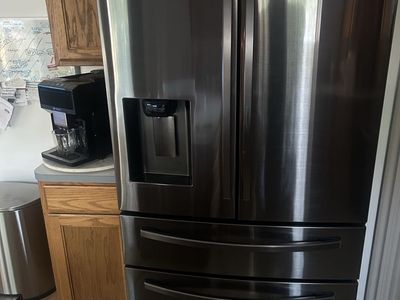 Samsung Black Stainless Kitchen Appliance Package - Refrigerator, Electric Range, Microwave