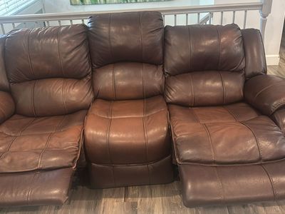 Leather couch with power recliners and headrest on each end