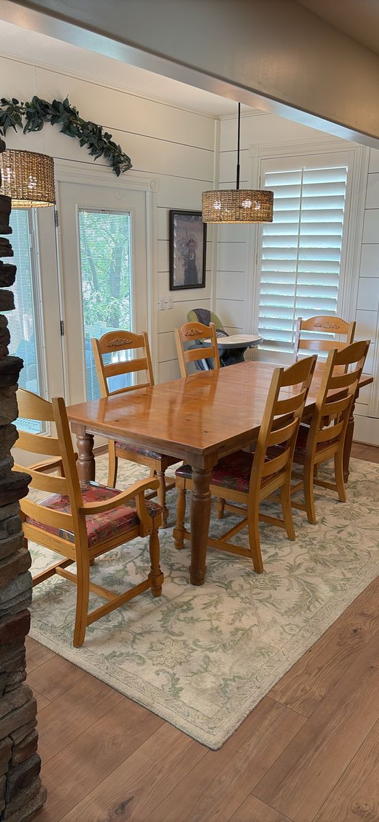 Wooden dining table with 6 matching chairs