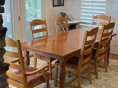 Wooden dining table with 6 matching chairs