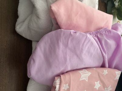 Bassinet mattress protectors and sheets