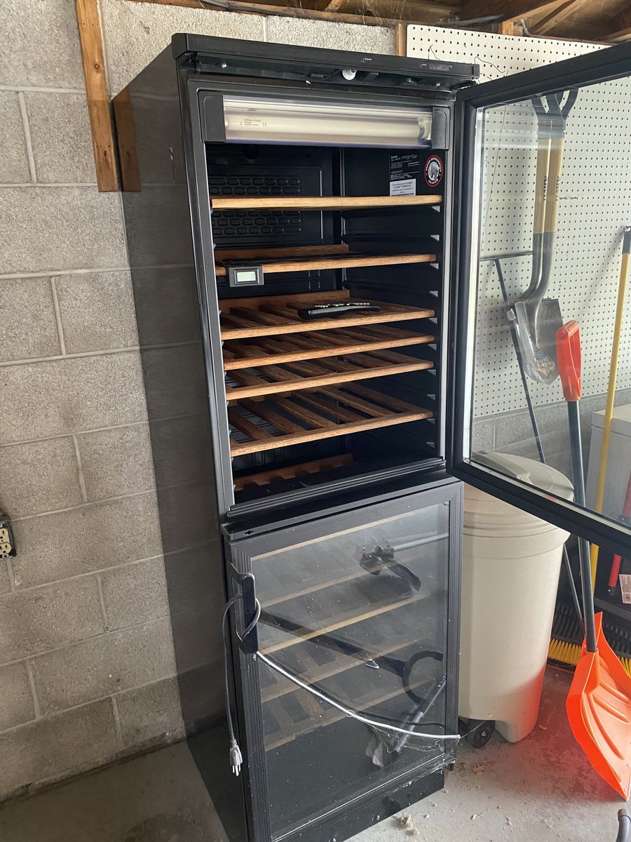 Wine Fridge With Wooden Shelves And Glass Door