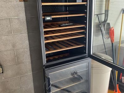 Wine Fridge With Wooden Shelves And Glass Door