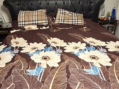 King Size Bed with Tufted Black Leather Headboard and Clean Mattress