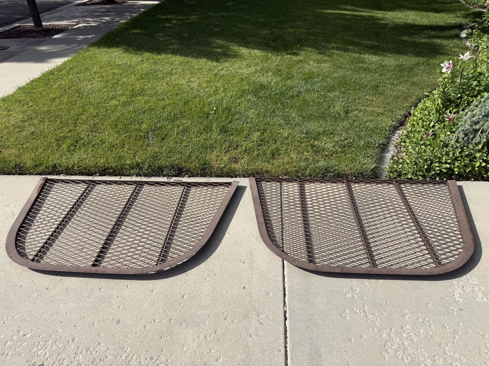 Two Brown Window Well Covers