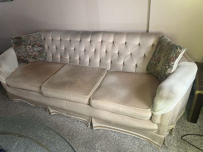 Free. Vintage Tufted Cream Fabric Sofa - 3 Seater with Skirted Base and Floral Accent Pillows