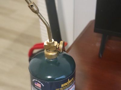 80% full Coleman propane torch with tip