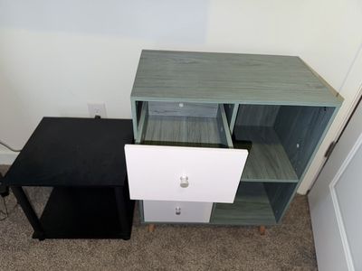 Modern Green and White Storage Cabinet with Shelves and Drawers