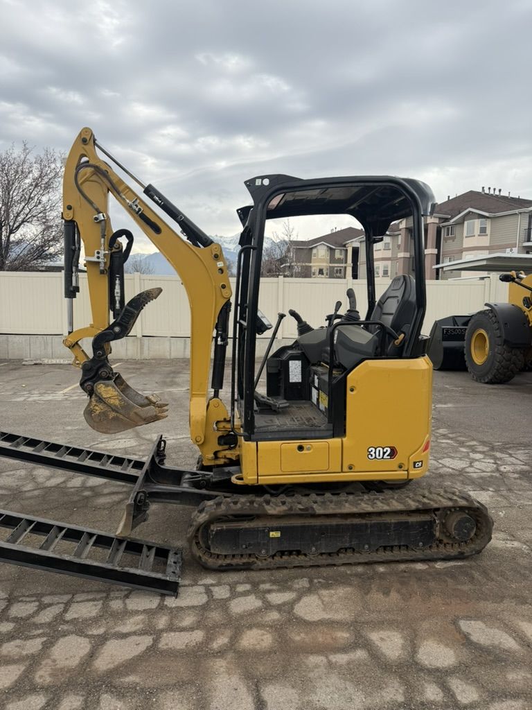 Mini Excavator Rental – Cat 302 Mini Excavator - Retractable Tracks for Backyard Access