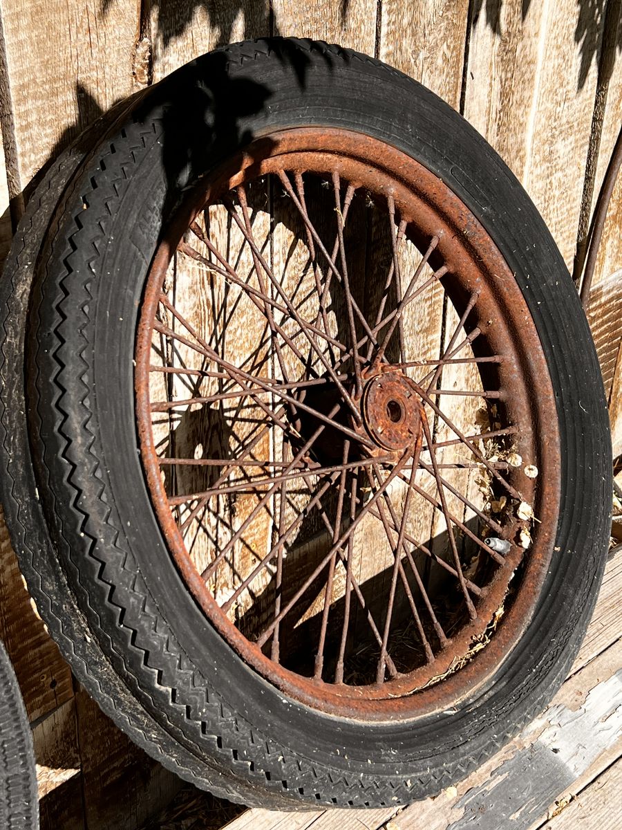 Vintage Motir cycle wheels yard art