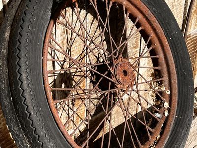 Vintage Motir cycle wheels yard art