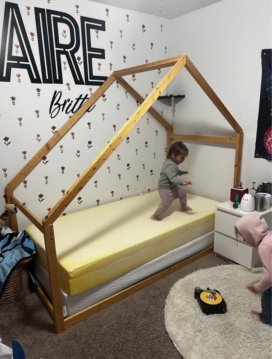 Twin Canopy bed with decorative drapes