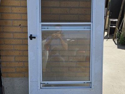 White Bifold Louvered Closet Doors and White Storm Door