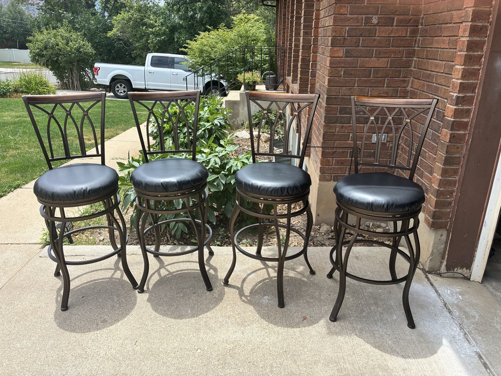 Set of 4 Bronze Iron & Wood Back Bar Stools with Black Faux Leather Swivel Seats