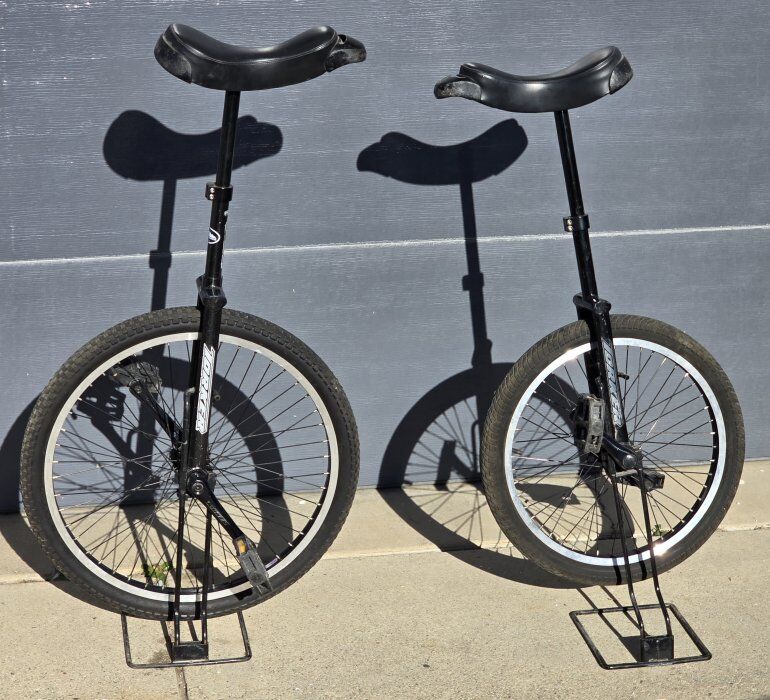 Pair Torker Unistar LX Unicycles W/Stands 20"&24""