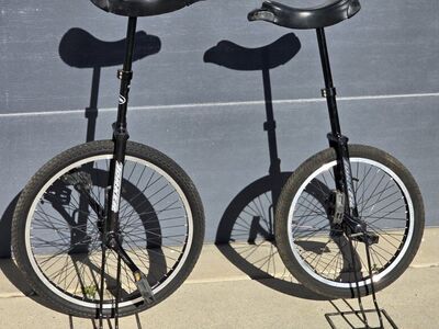 Pair Torker Unistar LX Unicycles W/Stands 20"&24""