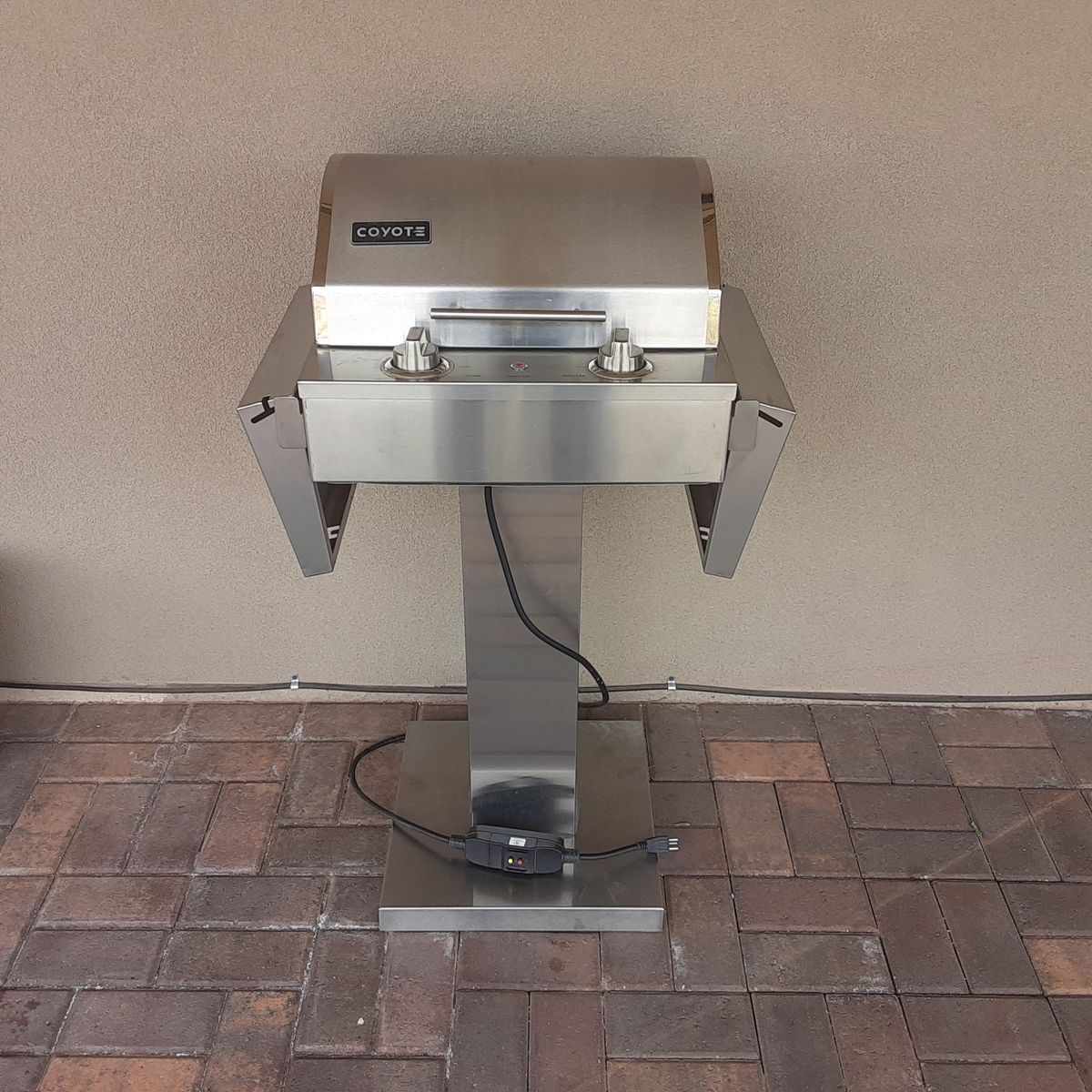 Stainless steel electric Coyote outdoor grill.