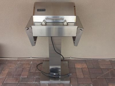 Stainless steel electric Coyote outdoor grill.