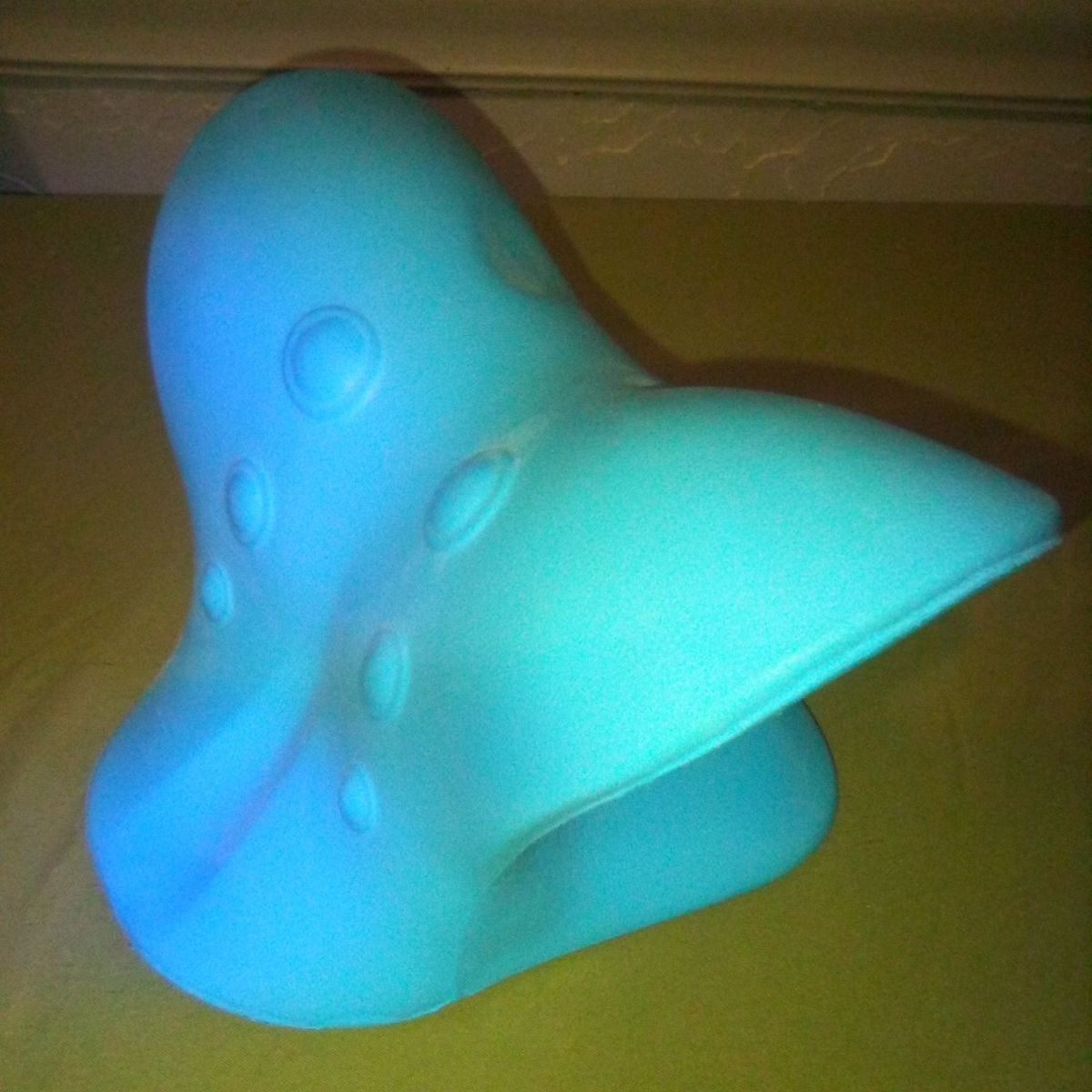 Cervical Traction Pillow or Neck Stretcher.