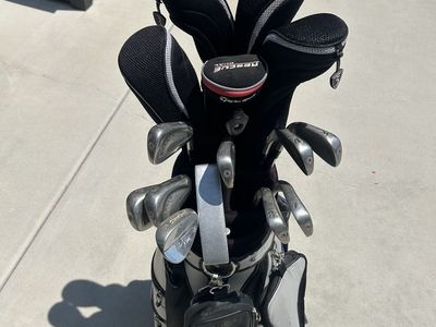 Taylormade Irons & assorted fairway woods with Mizuno Bag