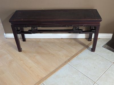 antique Chinese Ming-style altar bench or coffee table, crafted from elm wood and featuring a dark lacquered finish.