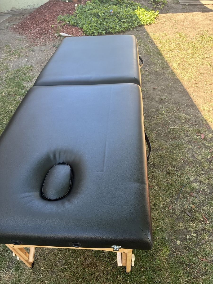 Folding massage table