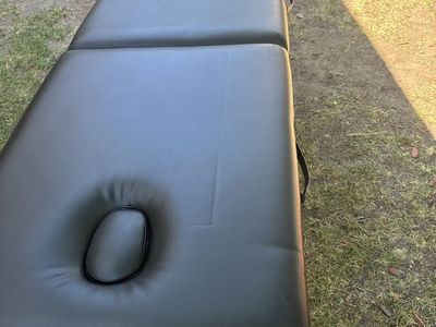 Folding massage table